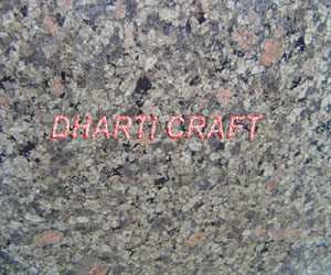 light green color granite with dots of black, pink and white